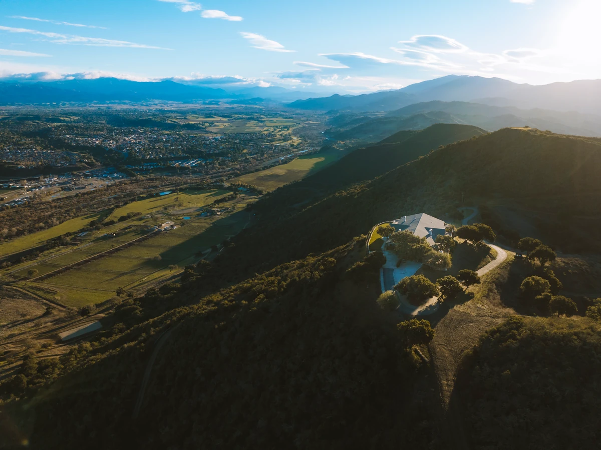 Santa Ynez Valley wine country landscape with rolling vineyards and mountain backdrop