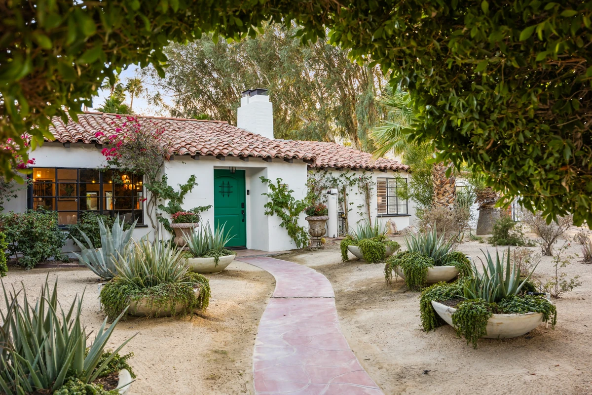 Spanish Revival estate exterior with desert landscaping