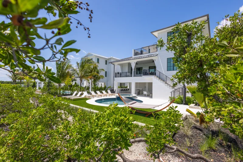 Florida Keys Wedding Village luxury villa exterior with pool and tropical landscaping