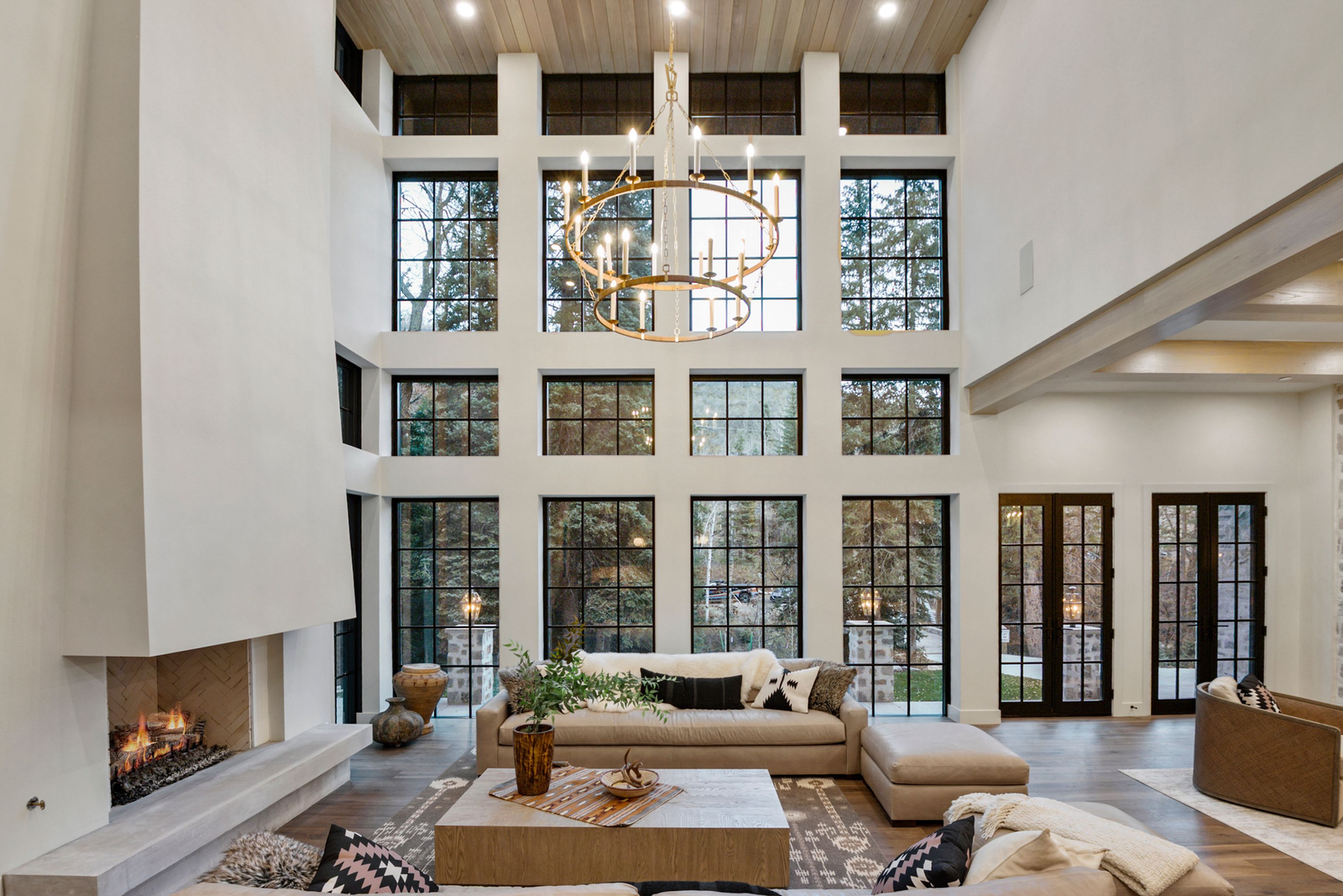 Interior living spaces with vaulted ceilings and mountain views