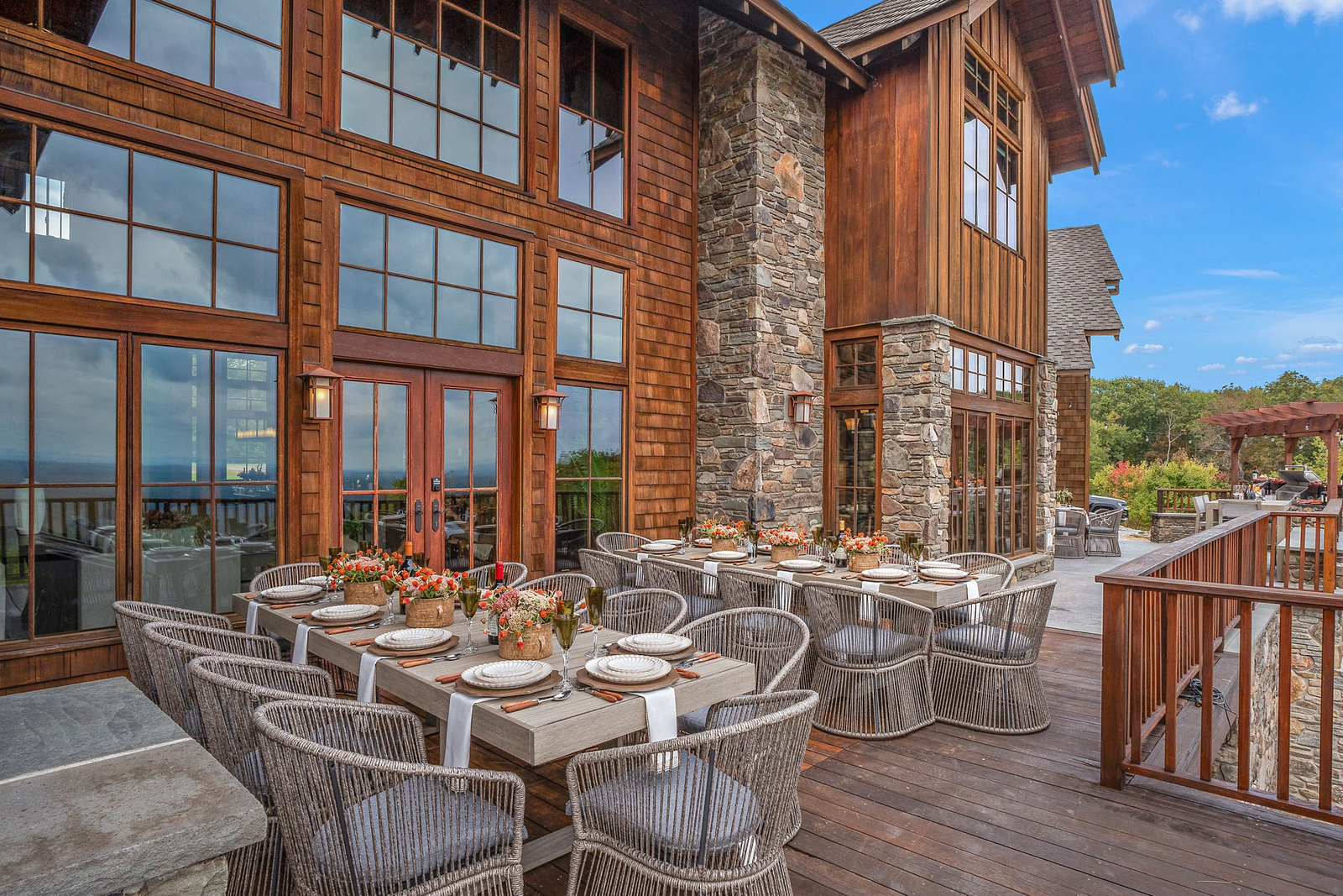 Lakefront event space with ceremony deck and mountain backdrop