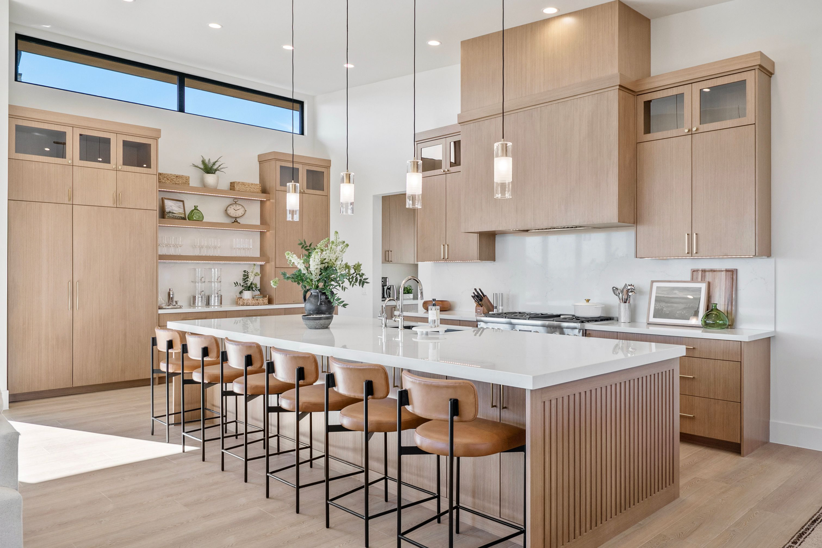 Modern interior with floor-to-ceiling windows and mountain views