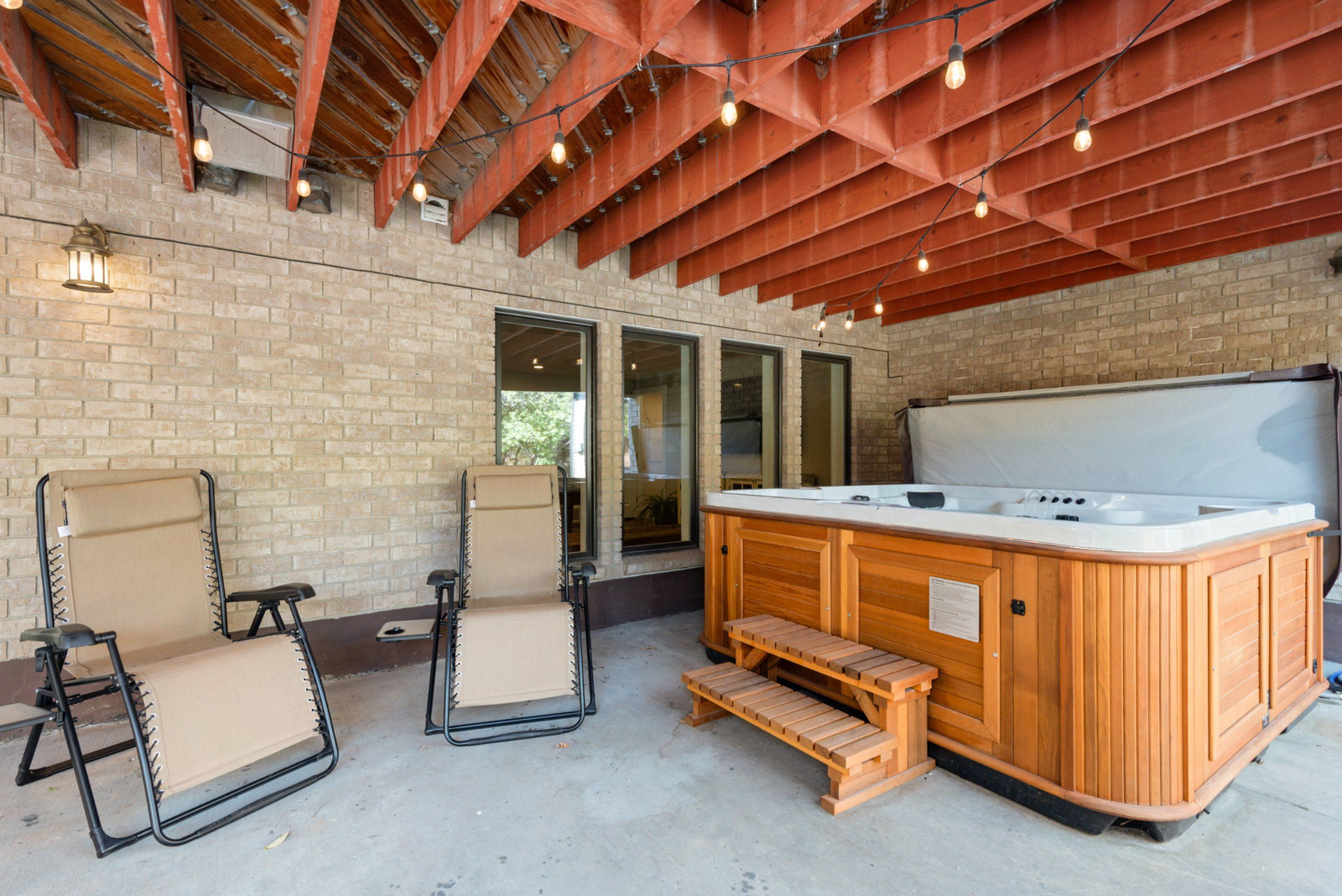 Hot tub and outdoor amenity area with mountain views
