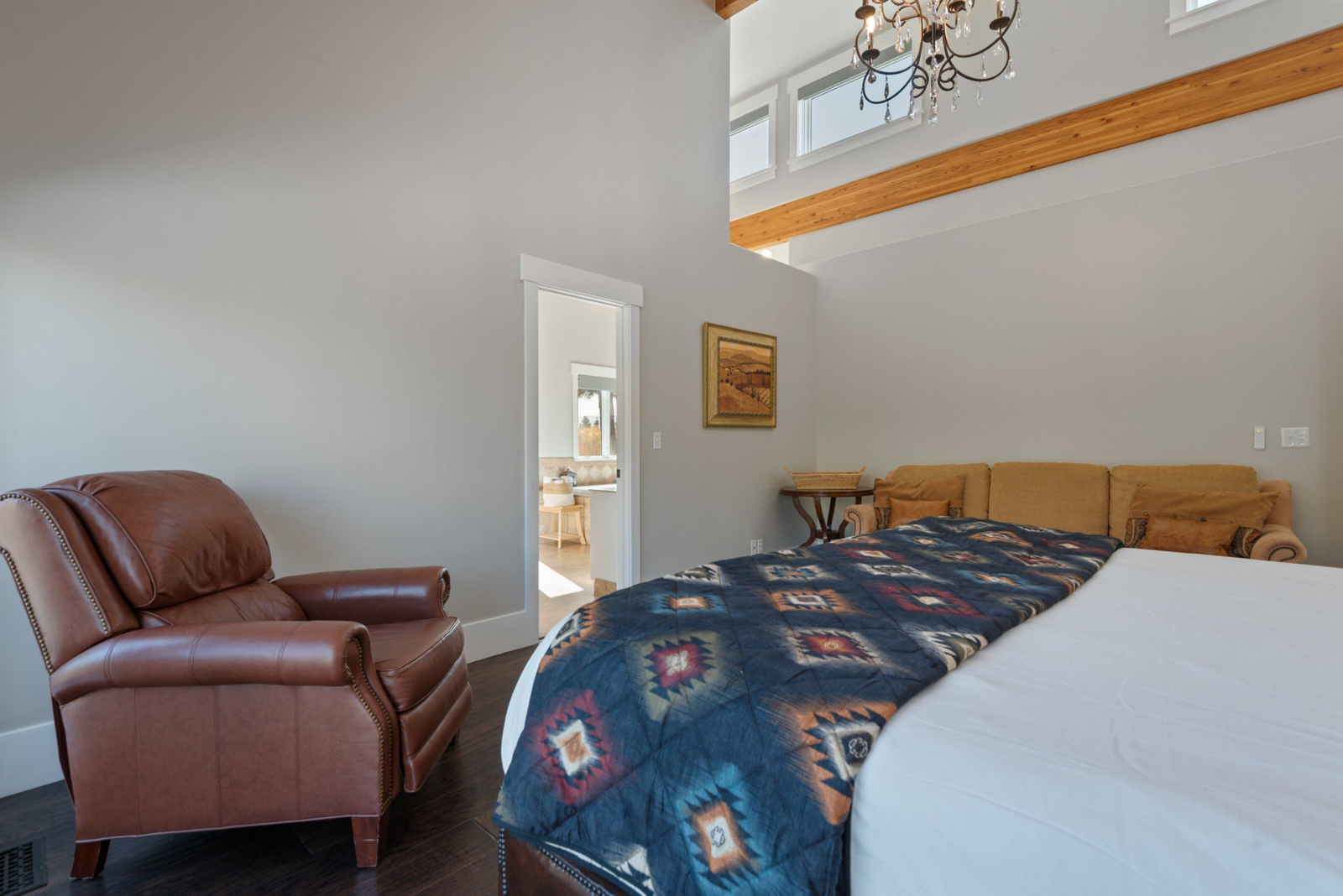 King suite bedroom with mountain views and natural light