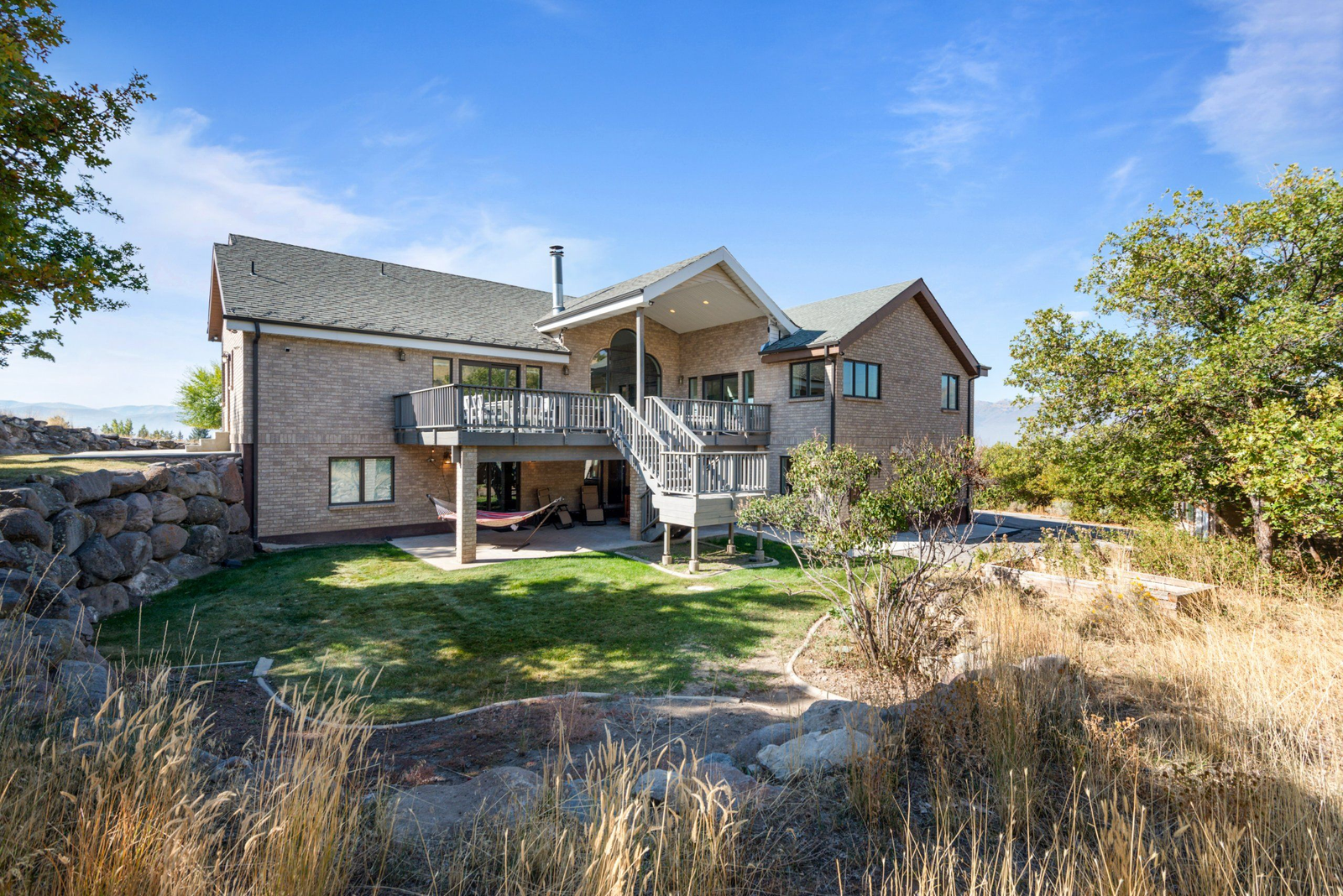 Expansive rear deck with mountain valley views and outdoor dining