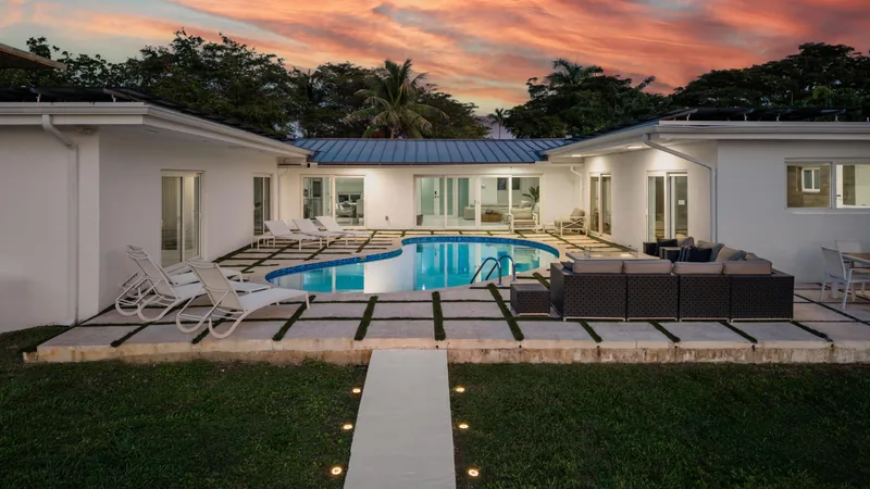Event space at Modern  Miami Beach Lakeside Retreat with Sun-Soaked Yard