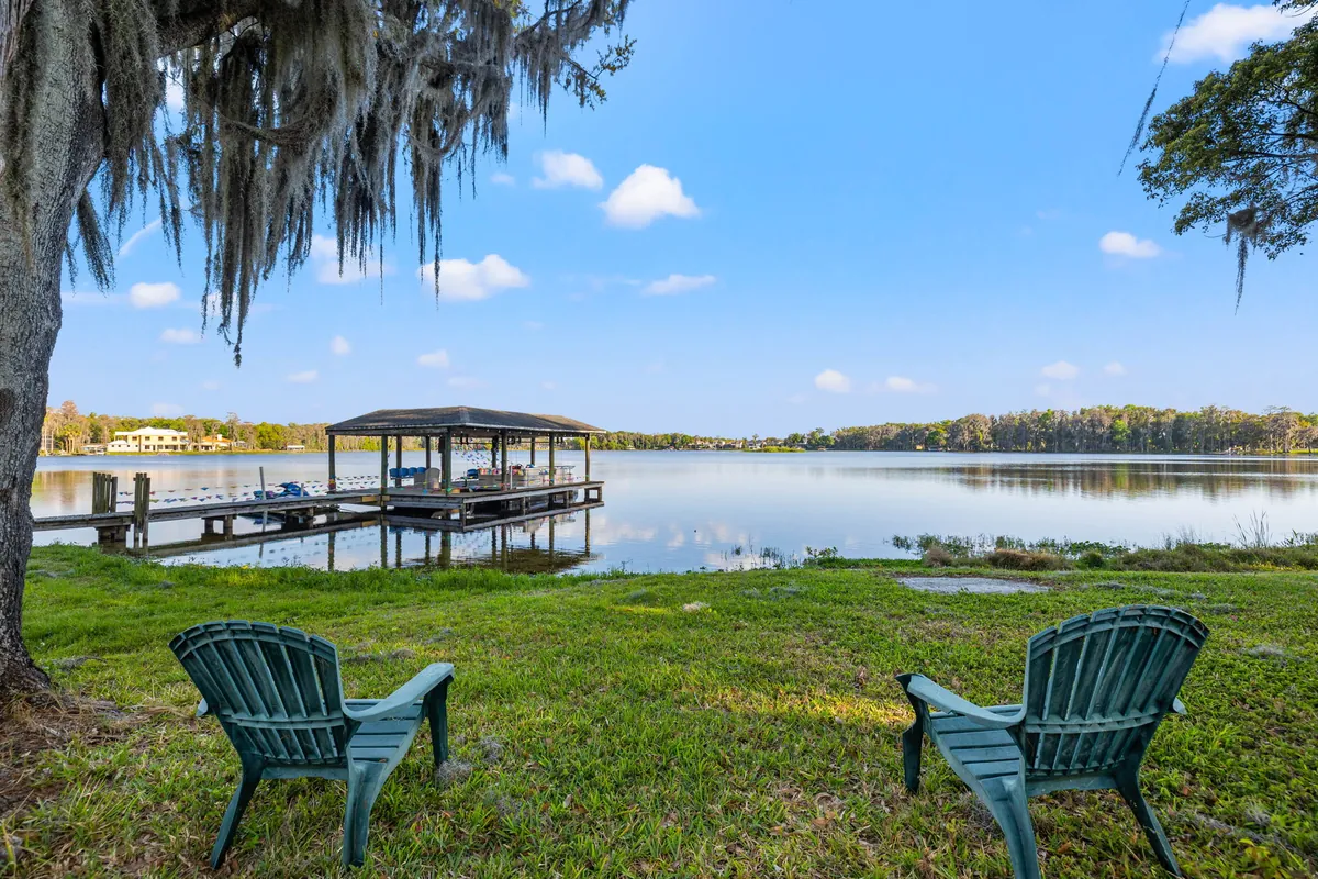 Wraparound brick porch with sweeping Platt Lake views