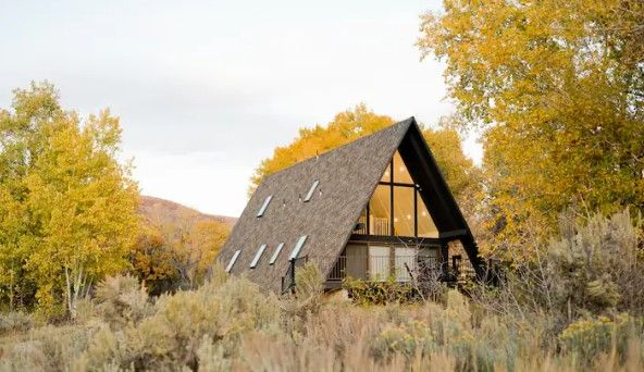 Storybook A-Frame exterior with mountain views and open acreage